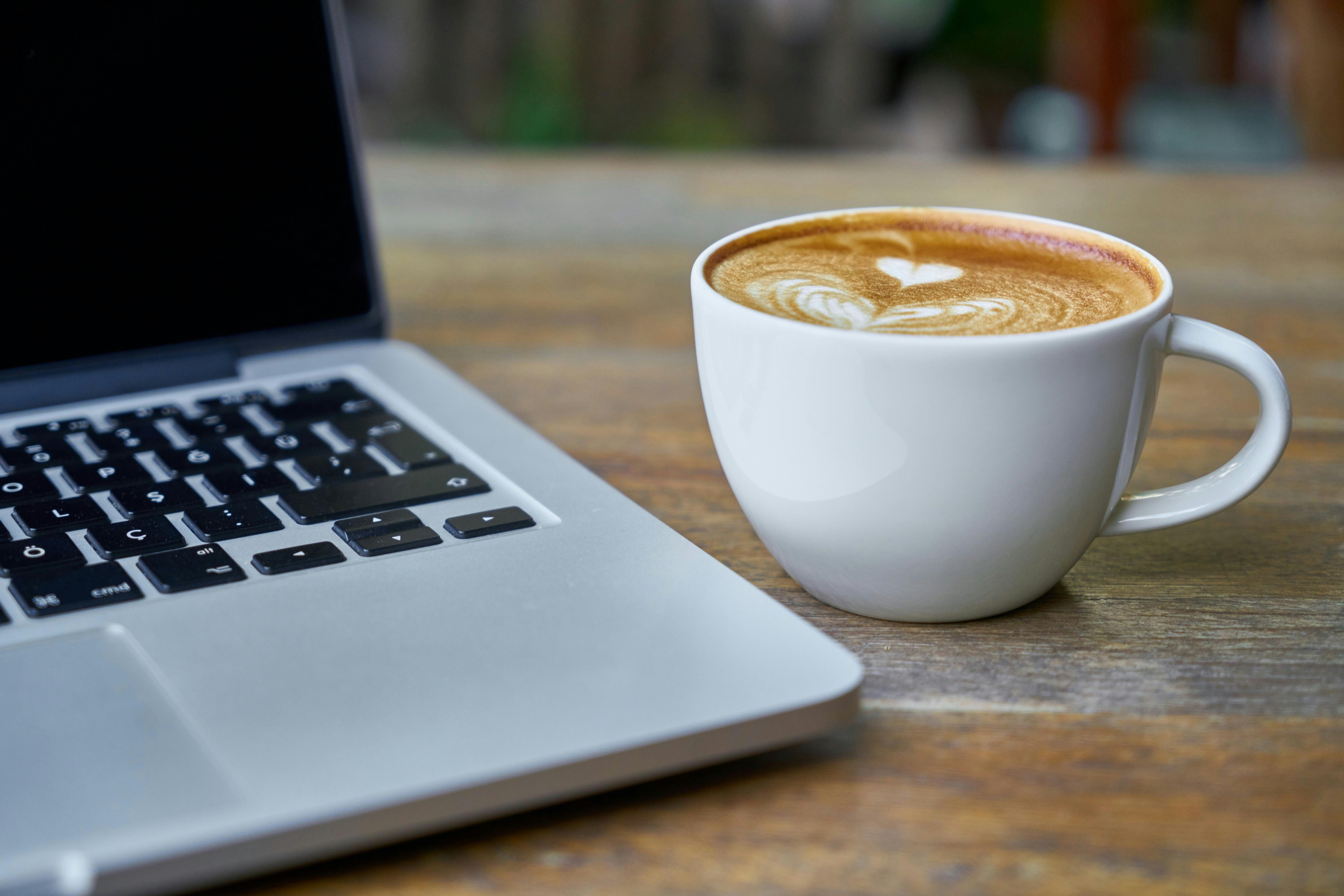 Photo by Pixabay: Latte next to computer
